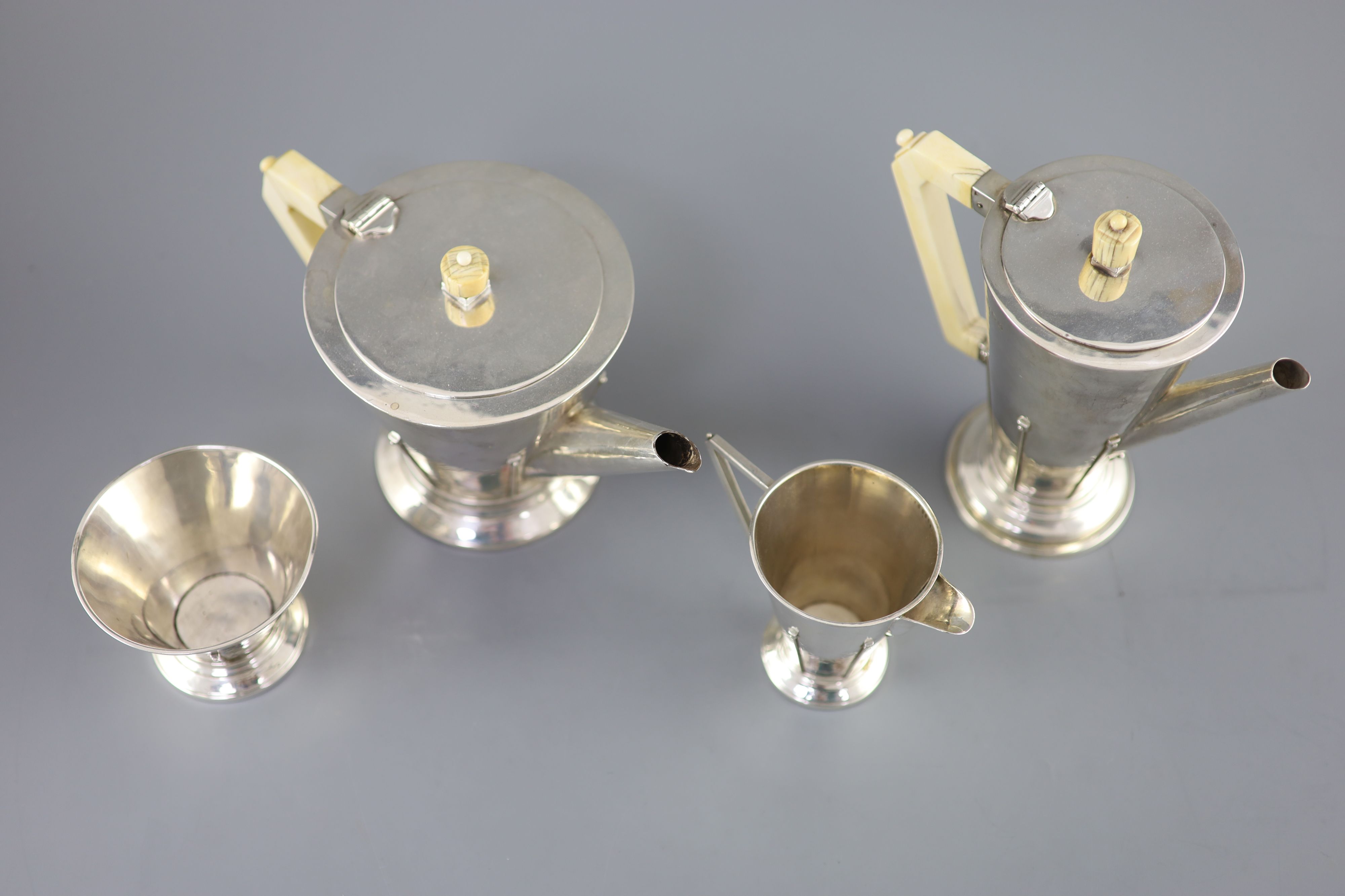 A stylish 1930s Art Deco silver four piece tea and coffee service by Charles Boyton,